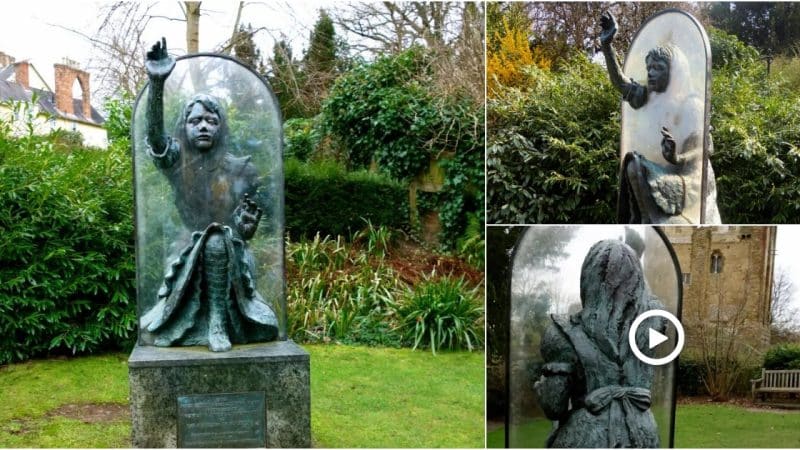 Alice Through The Looking Glass statue in Castle Grounds, Guildford, Surrey, England